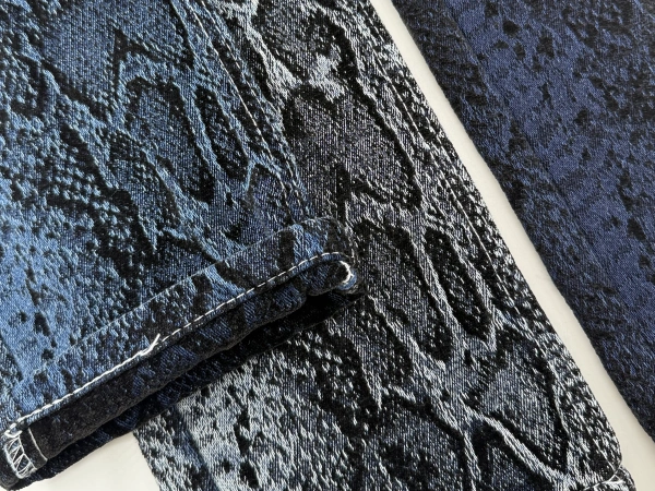 J1073 reptile texture chenille jacquard denim fabric detail showing raised snake pattern texture