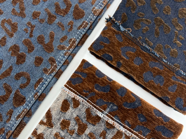 Blue leopard chenille denim fabric texture detail with flocking-like jacquard effect
