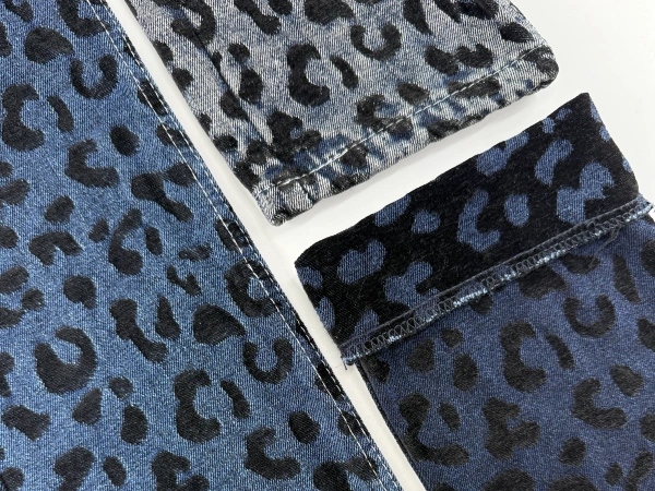 Closeup of brown leopard chenille jacquard denim fabric showing raised texture details_